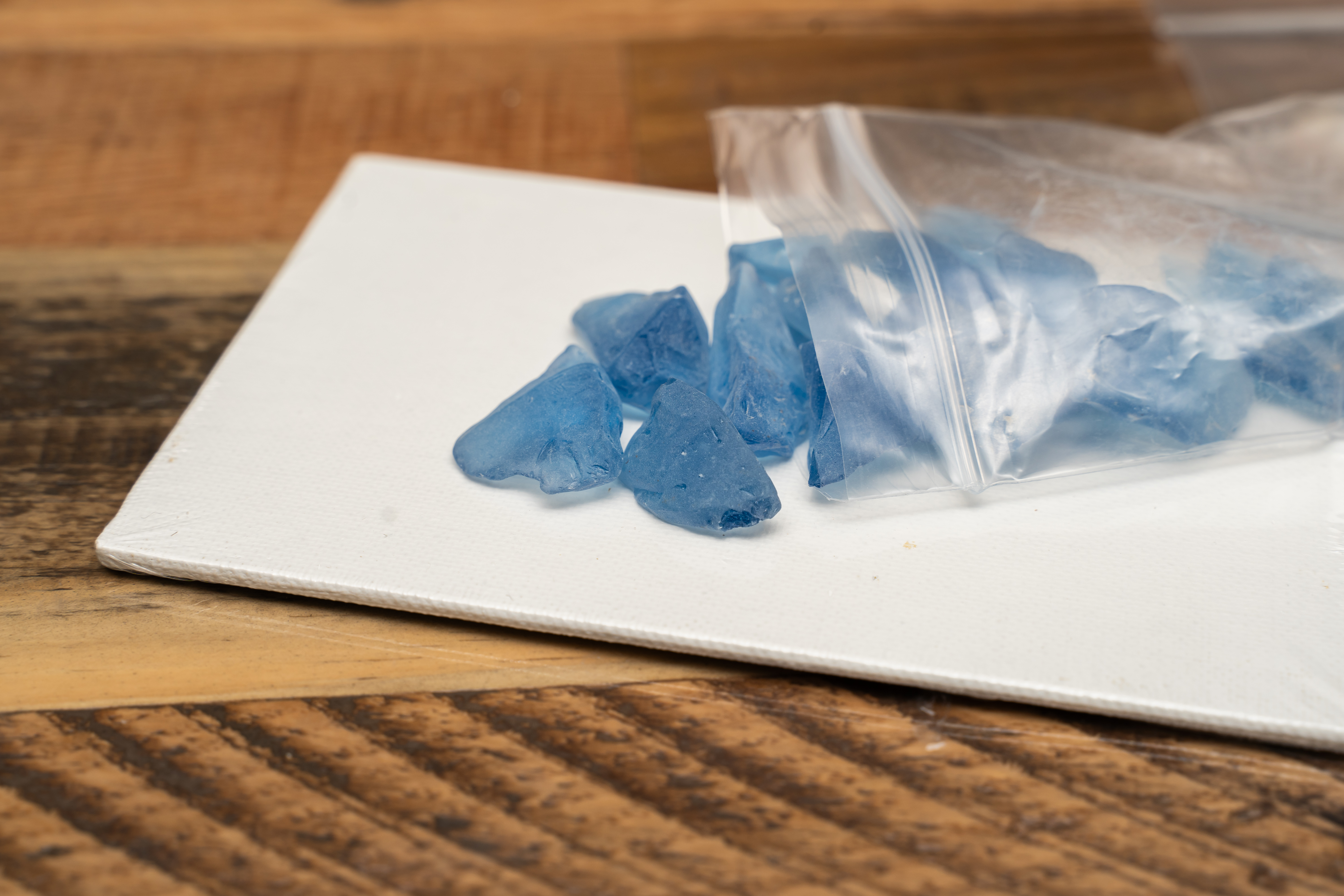 Blue seaglass spilled onto a white table